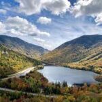 An aerial view of a lake in New Hampshire's mountains.