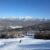 A view of a ski slope in New Hampshire, with mountains in the background.